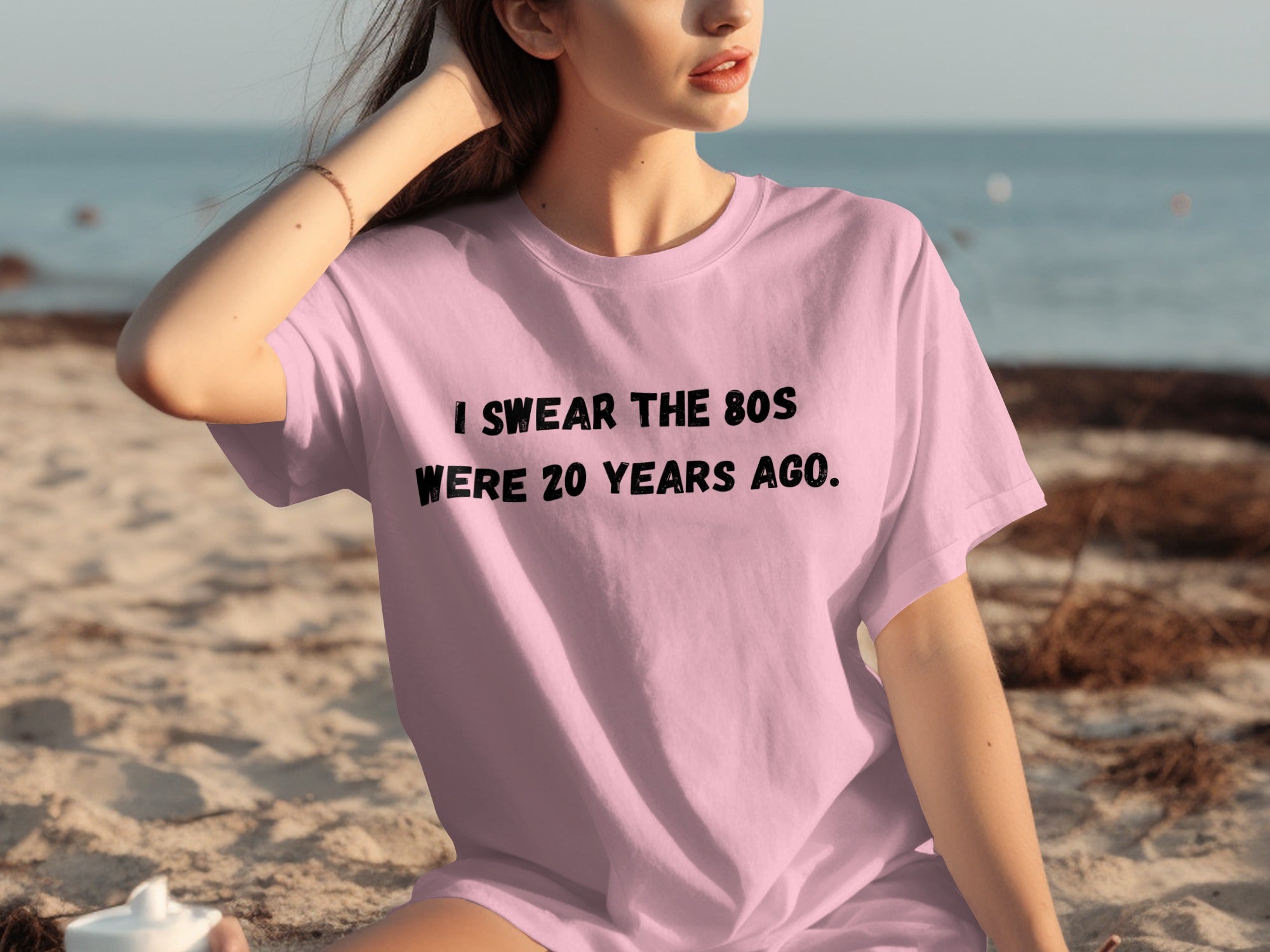 Pink t-shirt with black text: "I SWEAR THE 80S WERE 20 YEARS AGO."