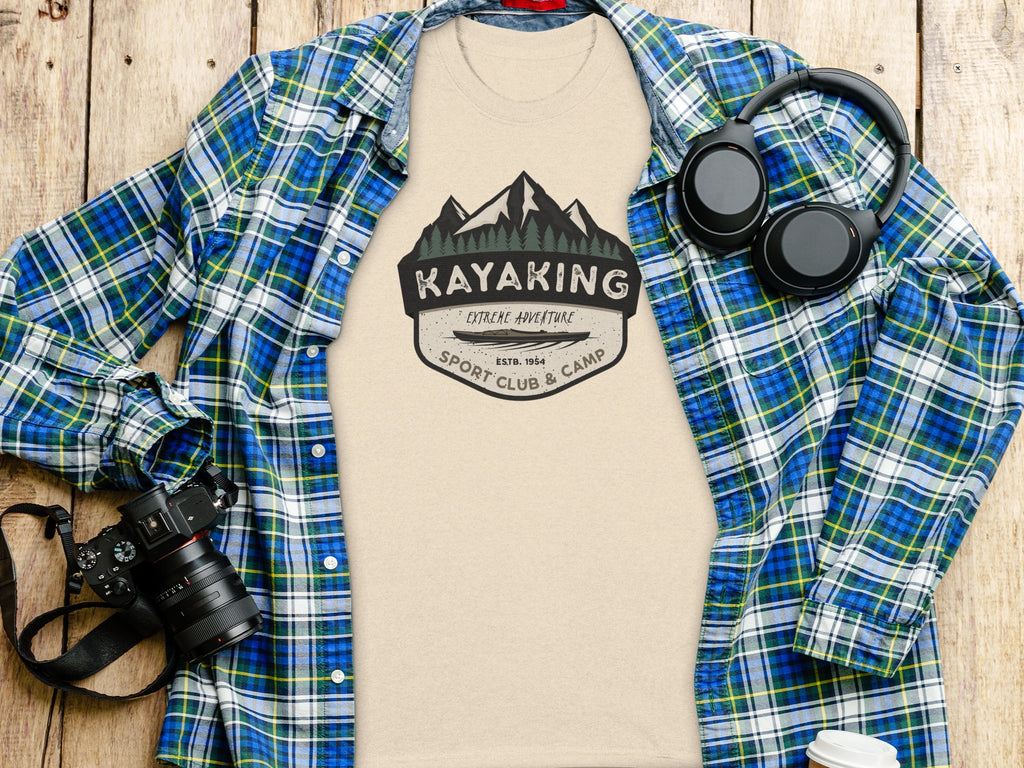 Tan t-shirt with "Kayaking Extreme Adventure Sport Club & Camp Estb. 1954" graphic.