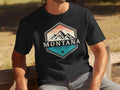 Black t-shirt with Montana mountains graphic, ESTD. 2021, and TAKE A HIKE.