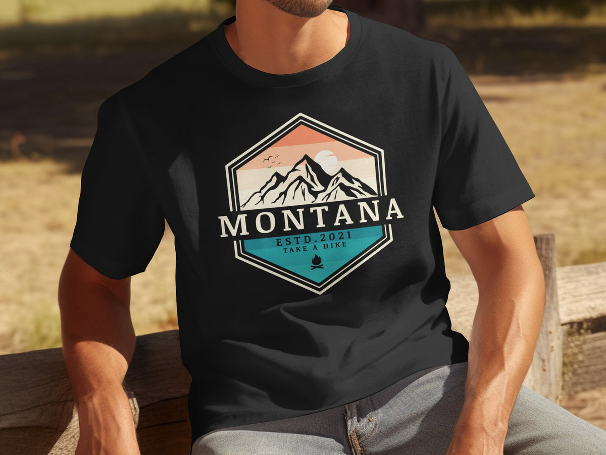 Black t-shirt with Montana mountains graphic, ESTD. 2021, and TAKE A HIKE.