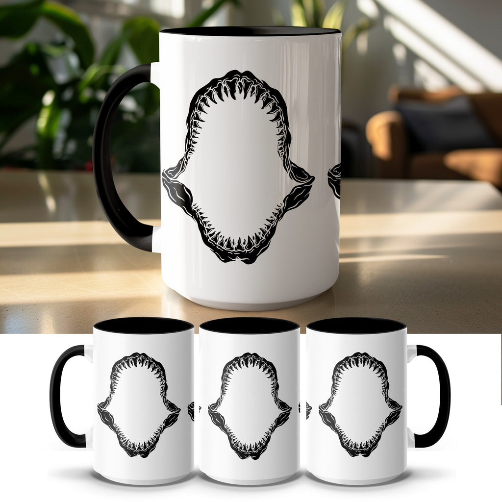 White mug with black interior and handle featuring a black shark jaw graphic.