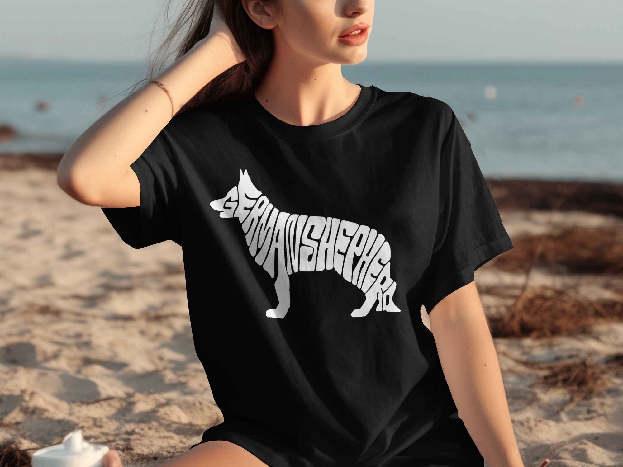 Black T-shirt with white German Shepherd dog shape made of text.