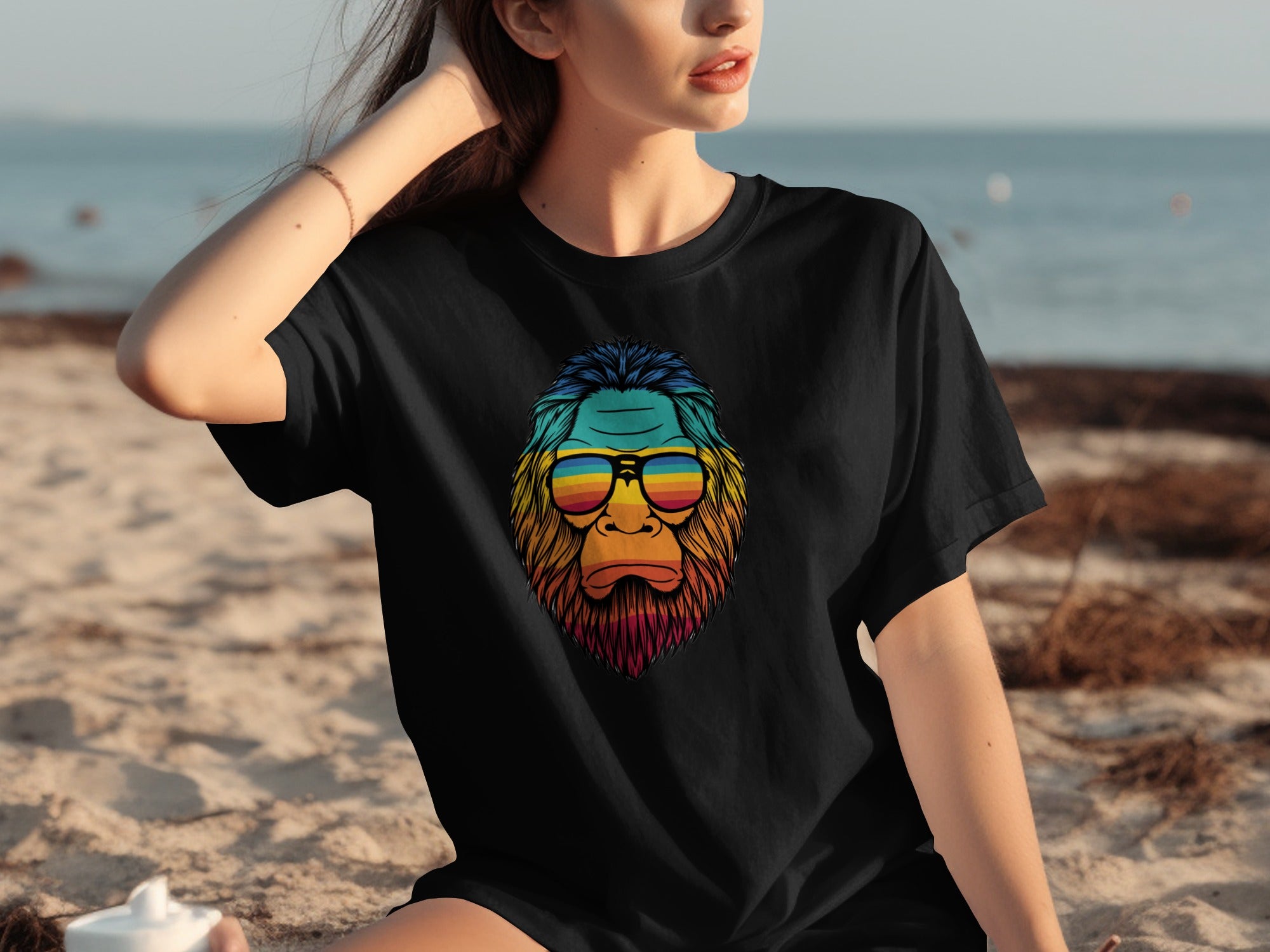Black t-shirt with a colorful Bigfoot graphic wearing retro sunglasses.