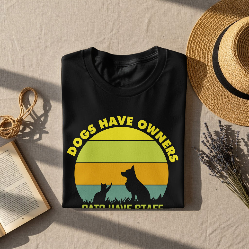 Black t-shirt with "Dogs Have Owners, Cats Have Staff" text and animal silhouettes.