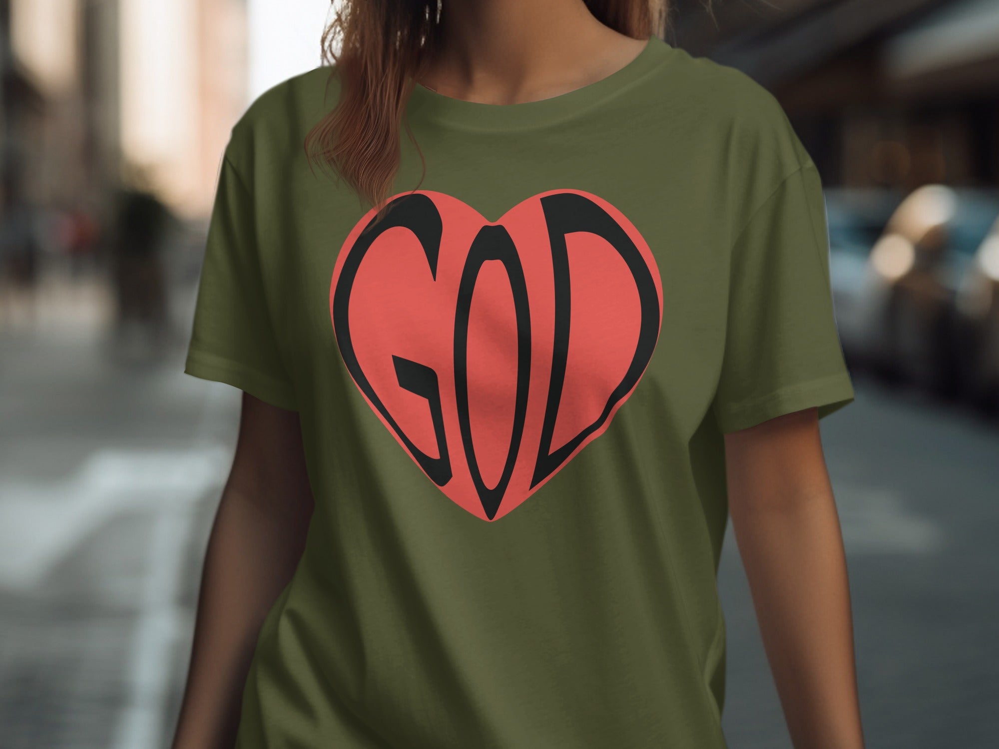 Green t-shirt with a red heart graphic containing the word GOD in black.