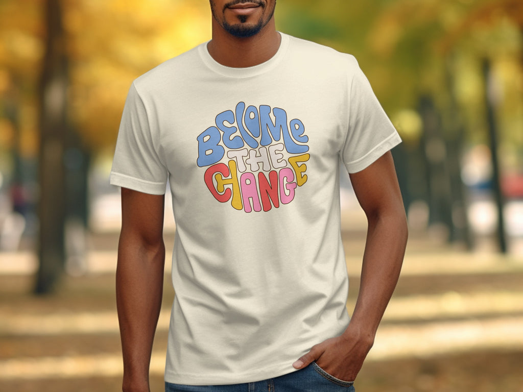 Cream t-shirt with "Become The Change" in colorful retro font.