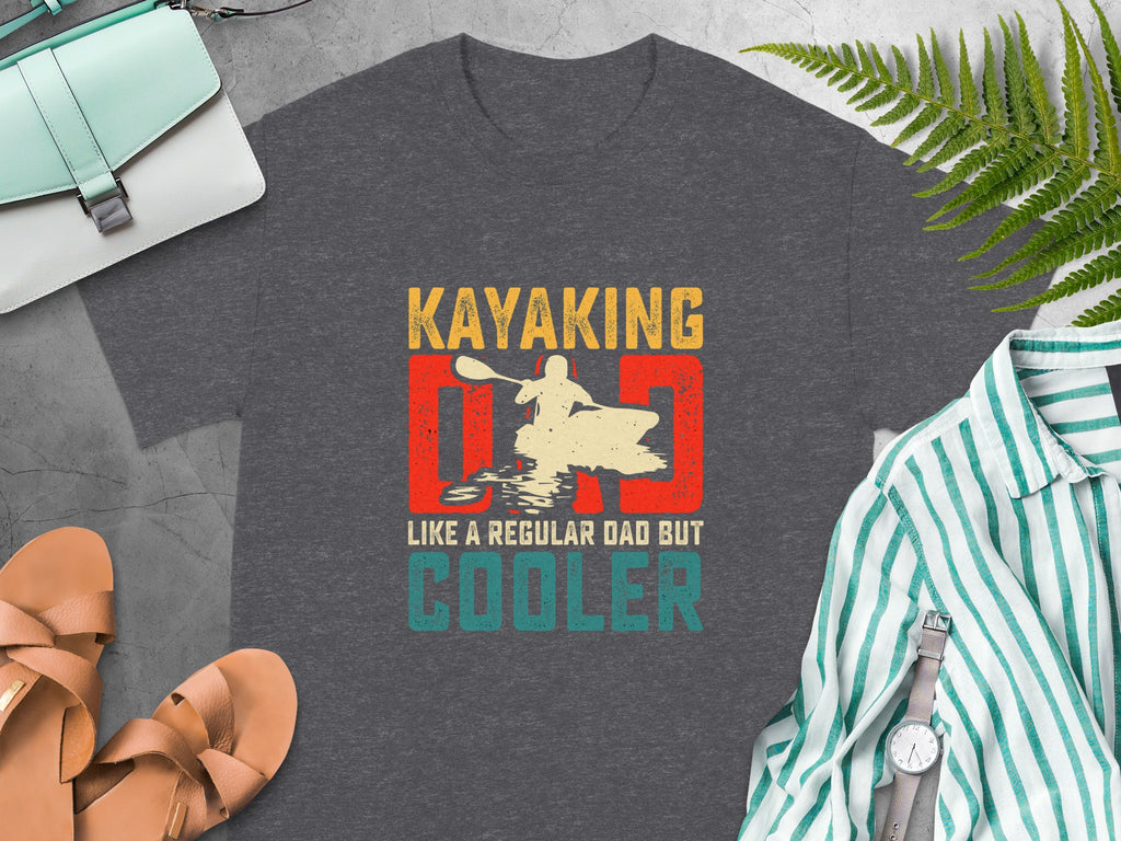 Dark grey t-shirt with "Kayaking Dad Like a Regular Dad But Cooler" graphic.