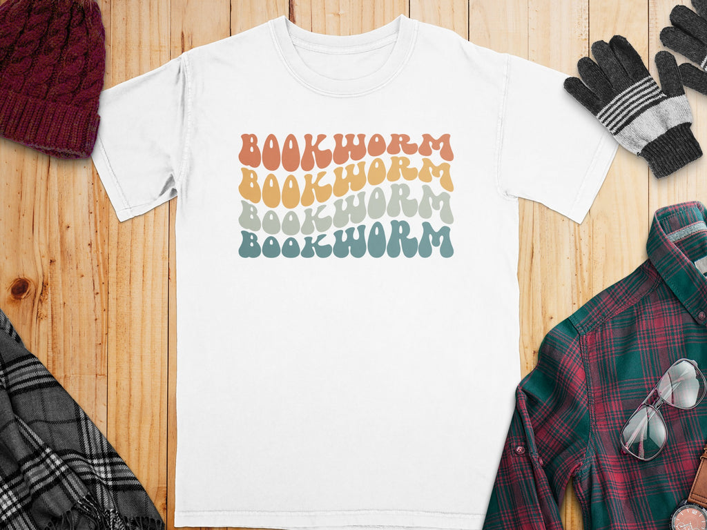 White t-shirt with stacked, retro "BOOKWORM" text in multiple colors.