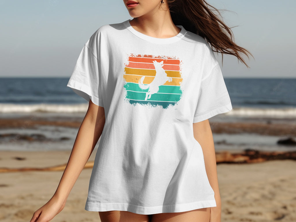 White t-shirt with a jumping dog silhouette on a distressed retro striped background.
