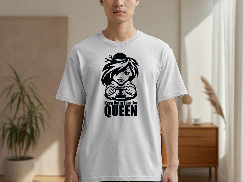 White t-shirt with black graphic of a woman holding a steering wheel and text "Keep Calm I am the QUEEN".