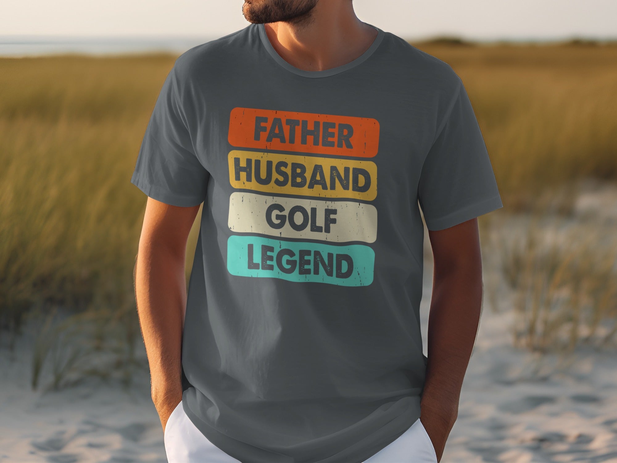 Grey t-shirt with "FATHER HUSBAND GOLF LEGEND" text in colorful striped boxes.