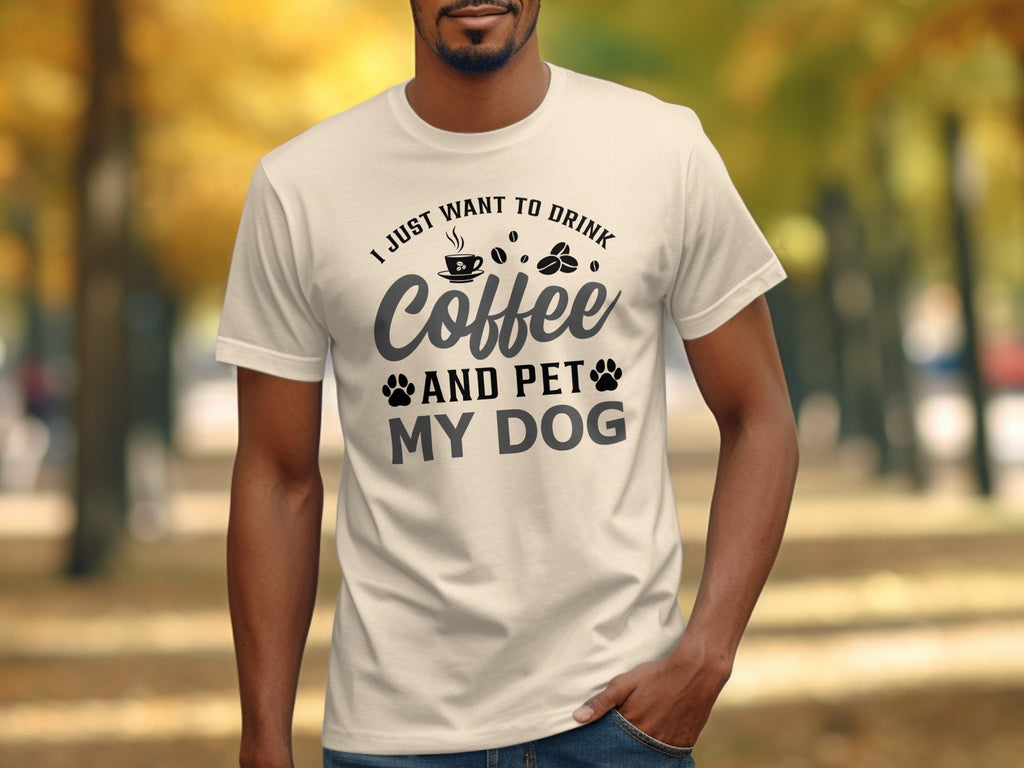 Light cream t-shirt with "I just want to drink coffee and pet my dog" graphic.