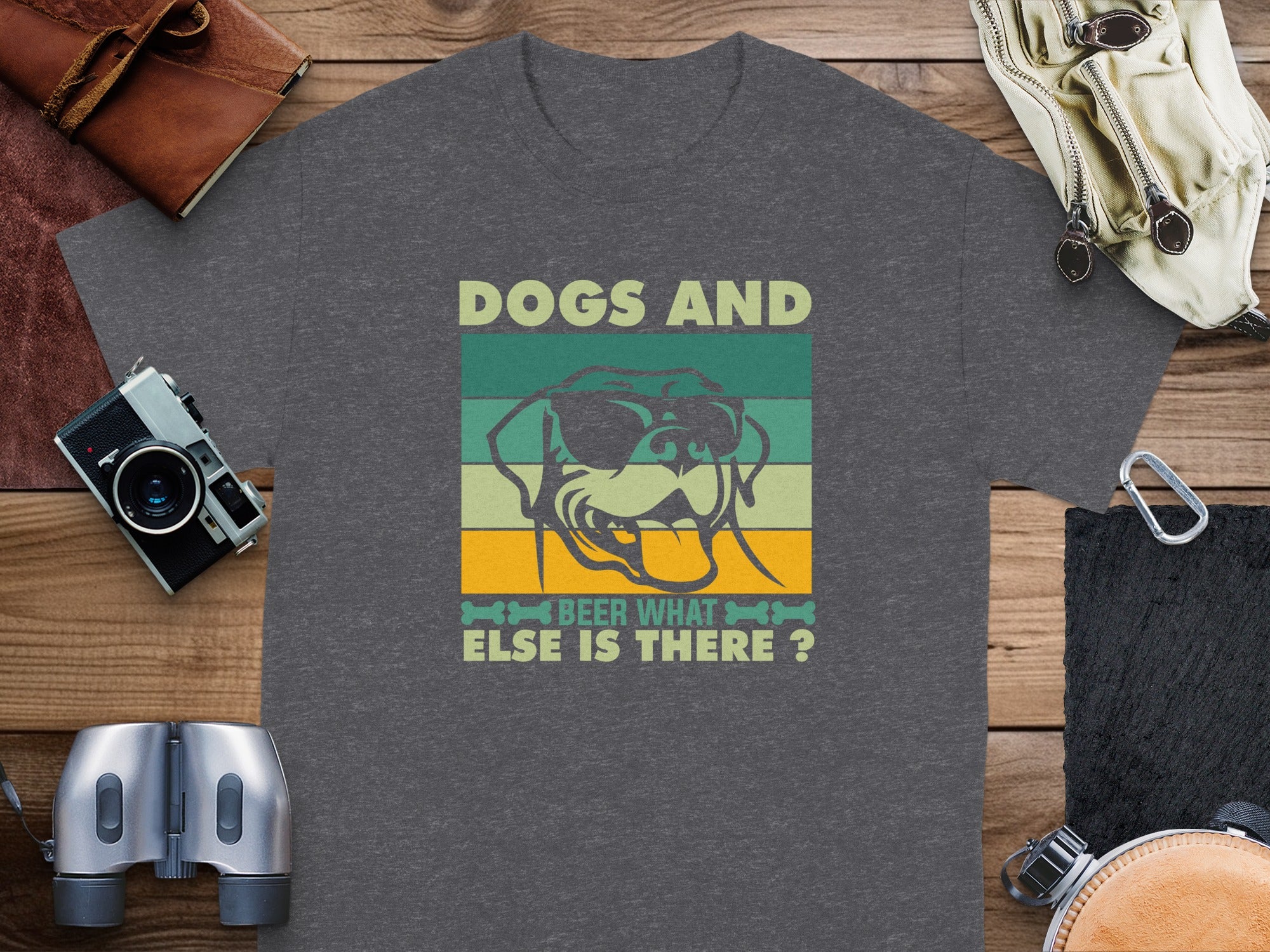 Dark gray t-shirt with a graphic of a dog wearing sunglasses and text "Dogs And Beer What Else Is There?".