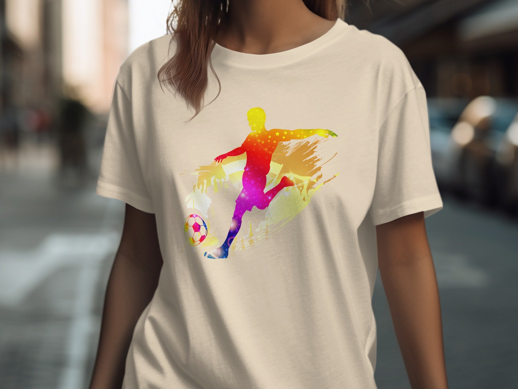 T-shirt with colorful silhouette of a soccer player kicking a ball.