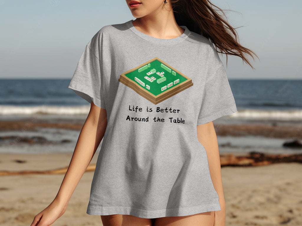 Gray t-shirt with mahjong game illustration and text "Life is Better Around the Table".