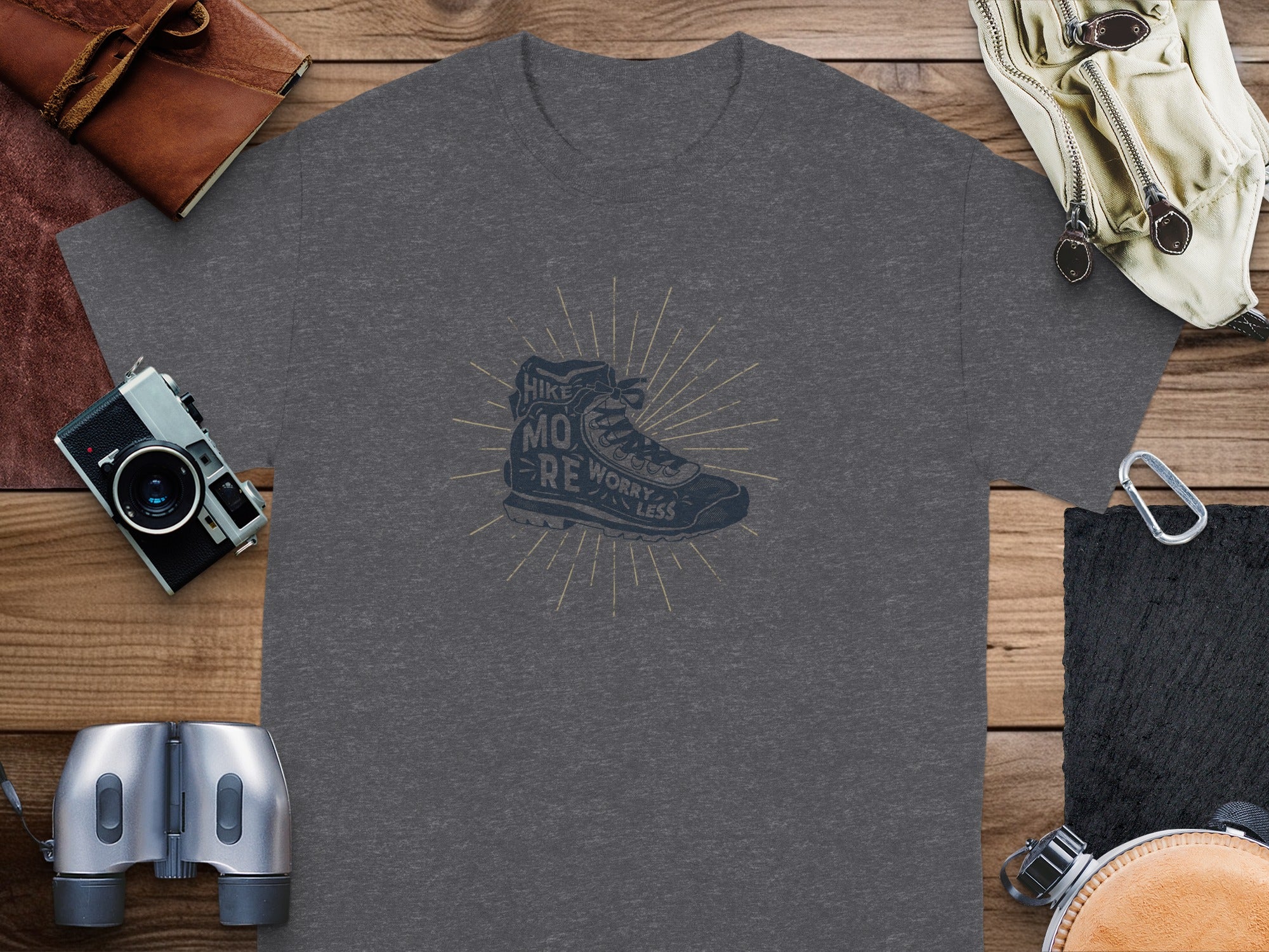 Dark grey t-shirt with a hiking boot graphic and the text "Hike More Worry Less".
