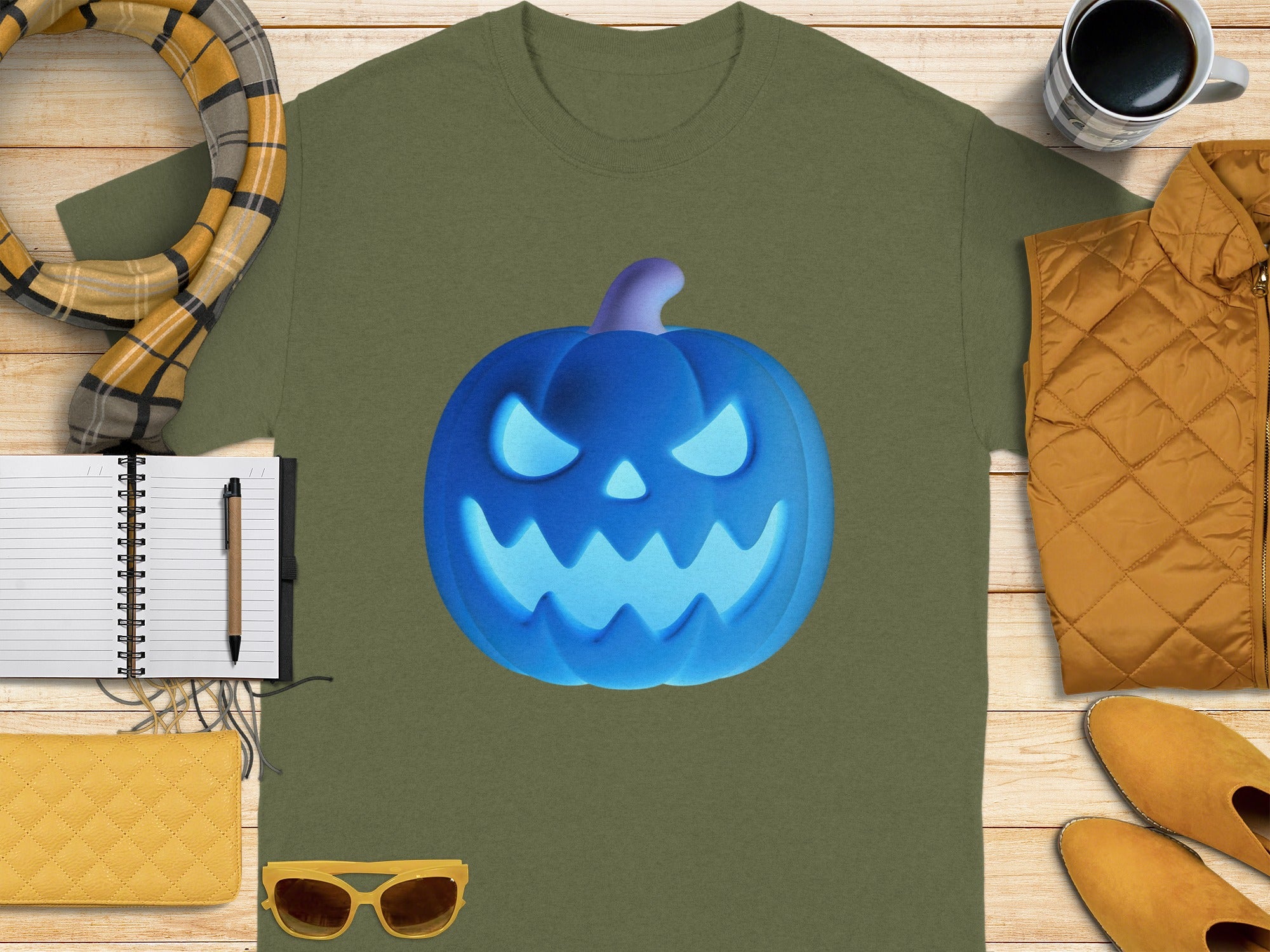 Green t-shirt with glowing blue jack-o'-lantern graphic.