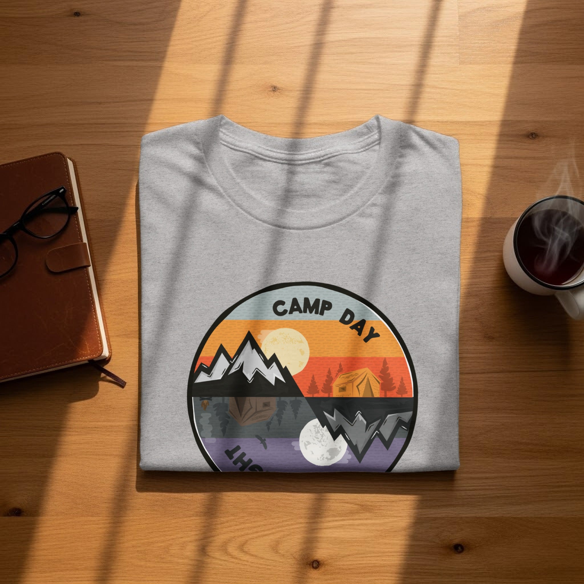 Gray t-shirt with a circular graphic of camping day and night scenes: "CAMP DAY" text.