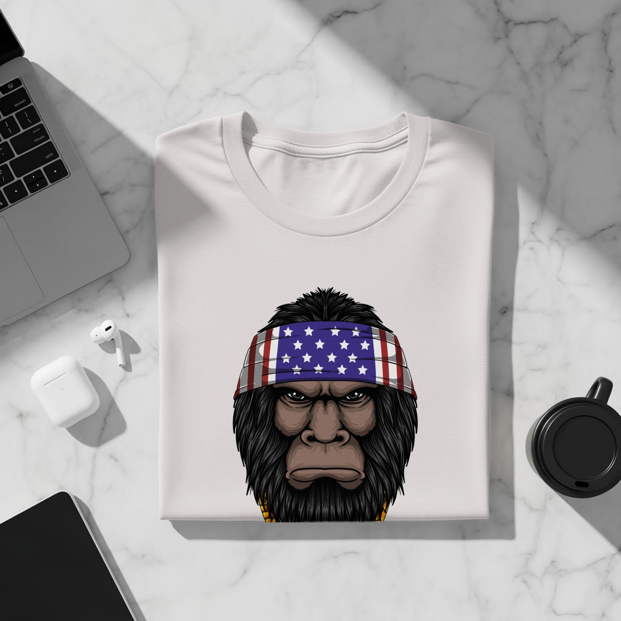 White t-shirt featuring a cartoon gorilla with an American flag bandana.