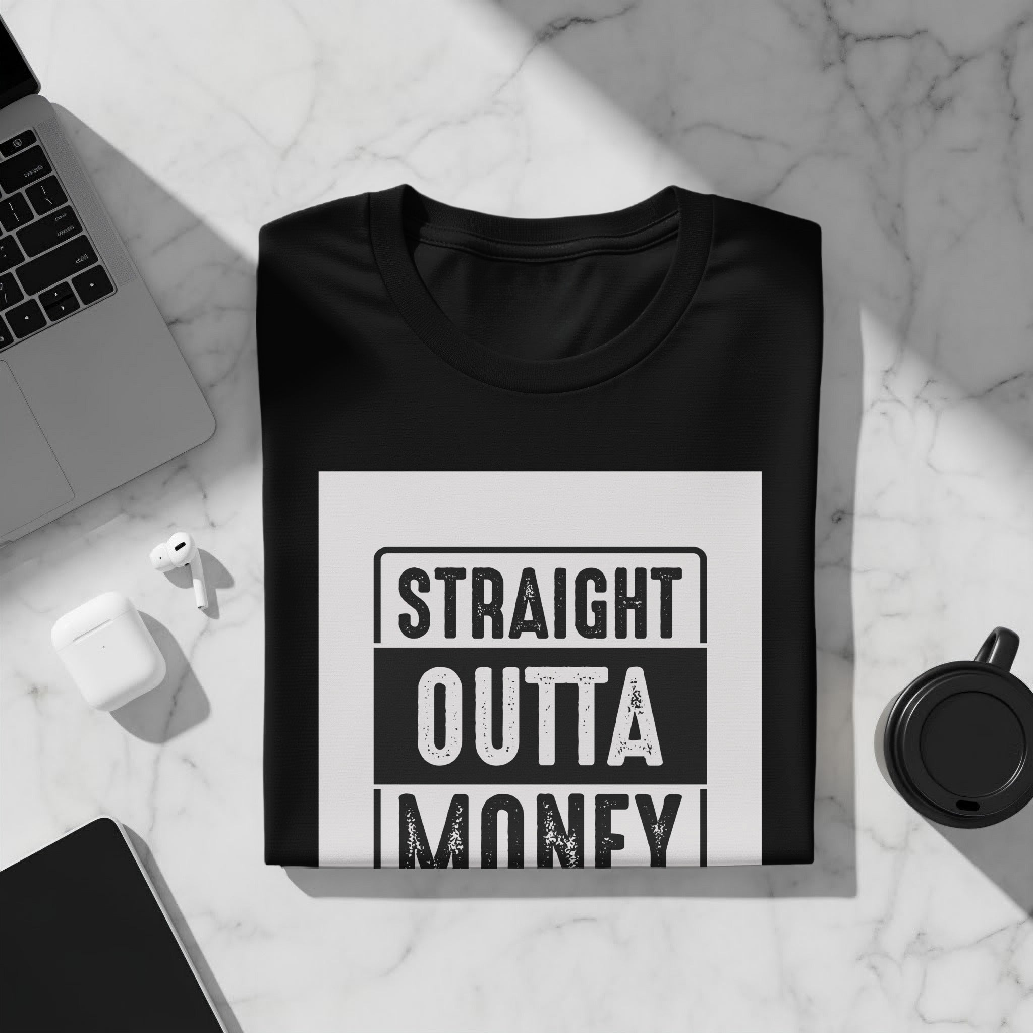 Black t-shirt with "STRAIGHT OUTTA MONEY" graphic on white textured background.