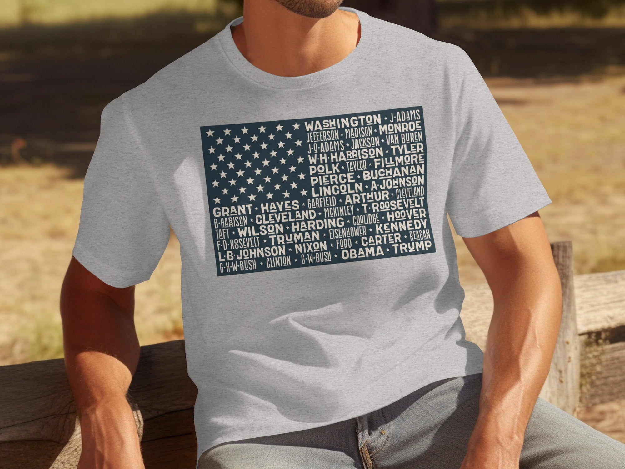 Grey t-shirt with US flag design listing presidents: Washington to Trump.