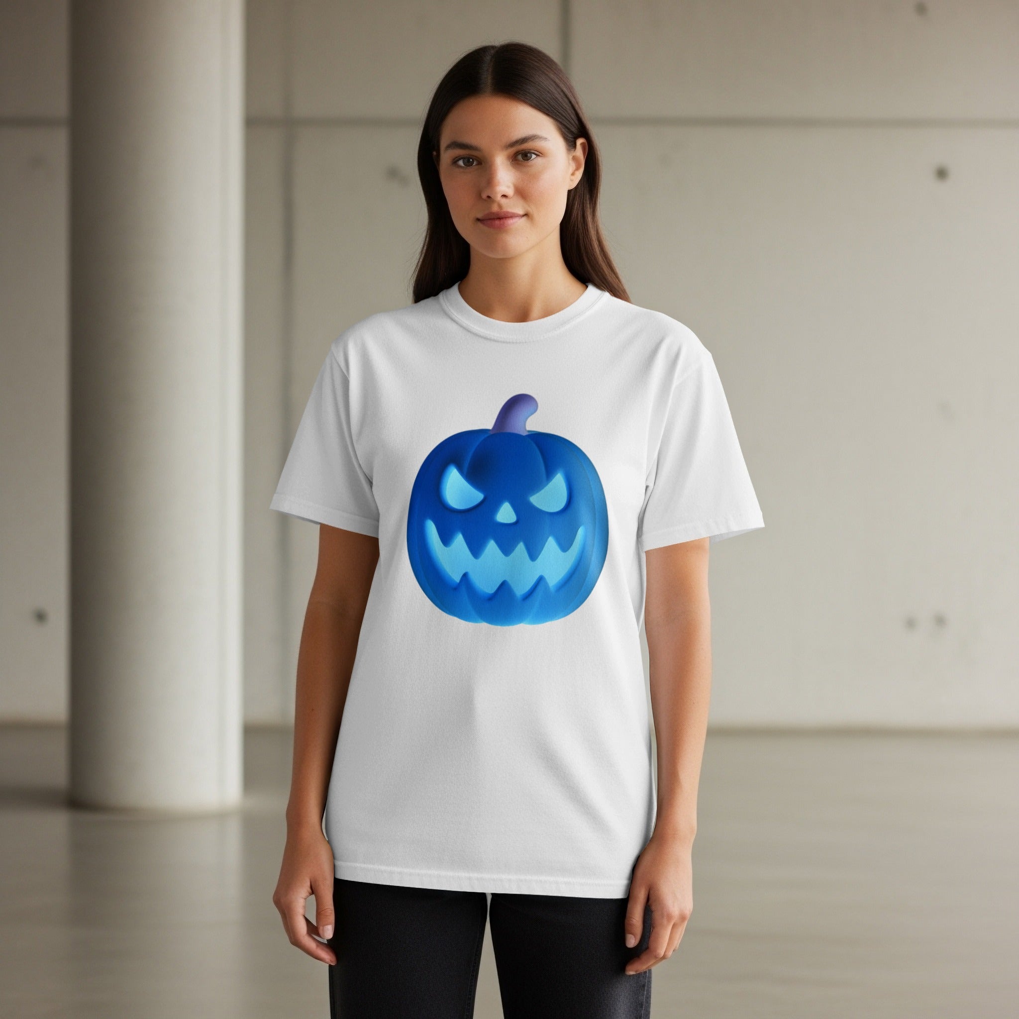 White t-shirt with glowing blue Halloween pumpkin graphic.