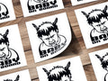 Baby on board stickers featuring a fierce baby with feathers in its hair.