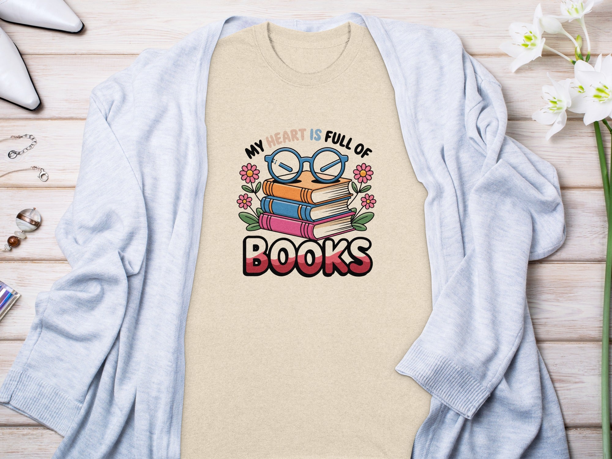 T-shirt graphic with stack of books and text "My heart is full of Books".