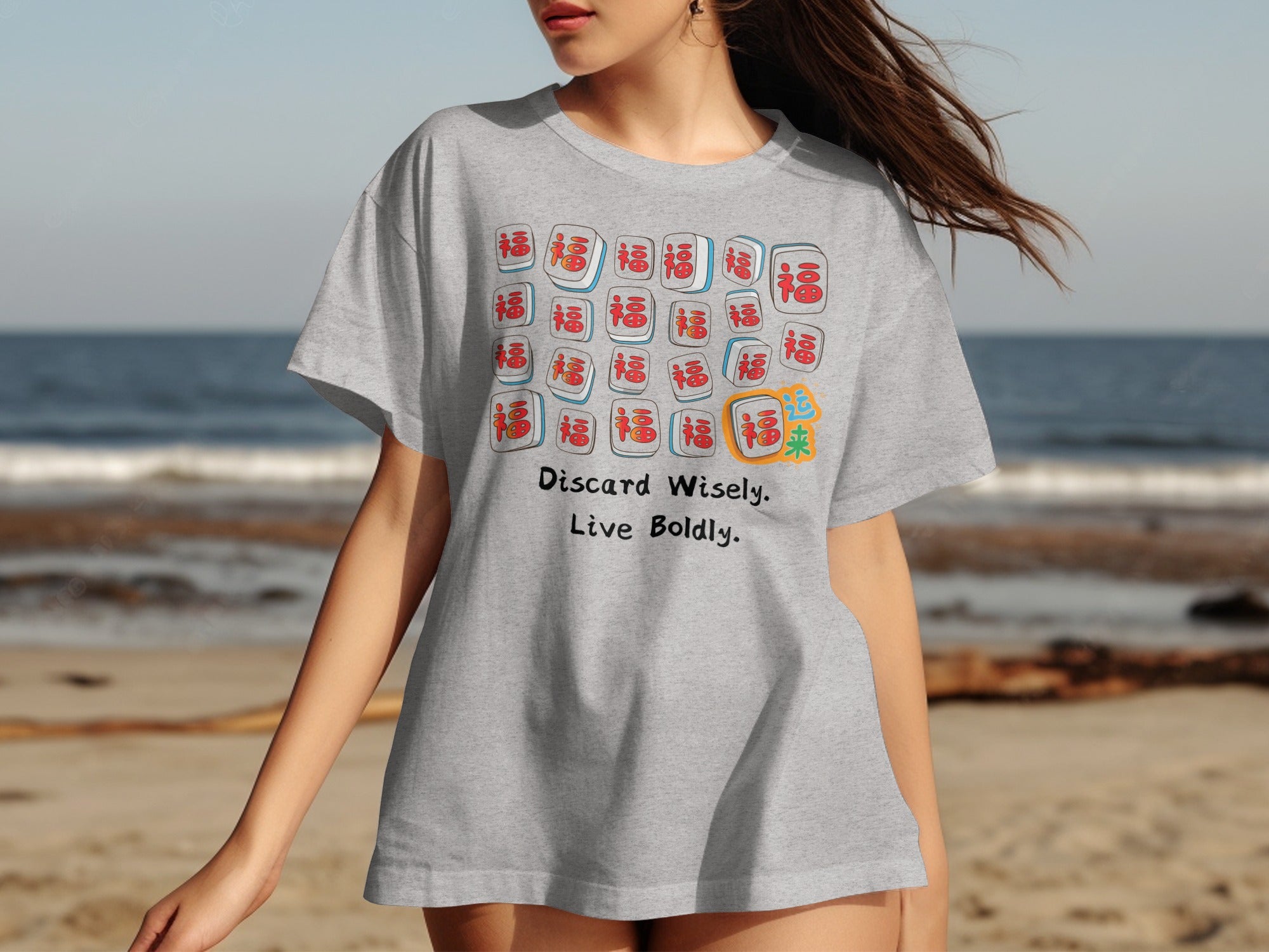 Gray t-shirt with mahjong tiles and text "Discard Wisely. Live Boldly."