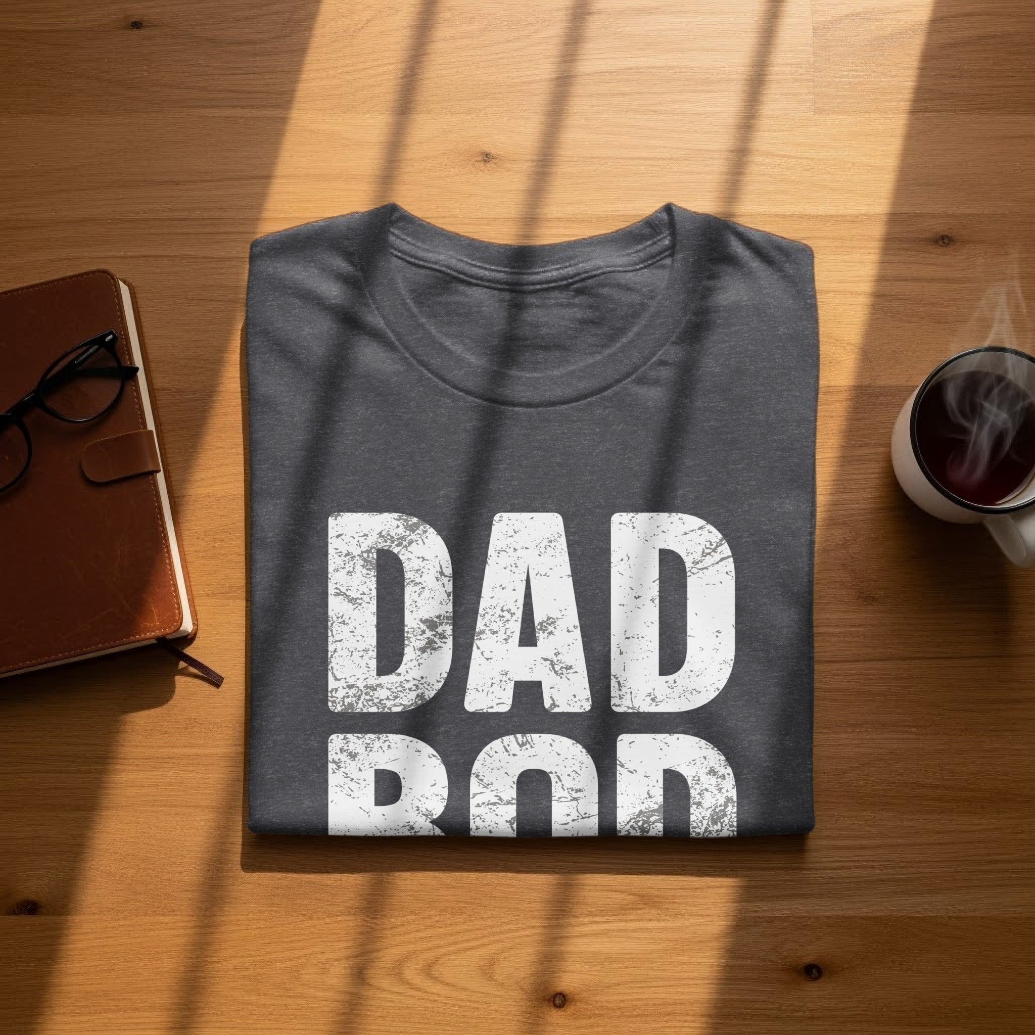 Dark gray t-shirt with distressed white text "DAD" over "ROD".