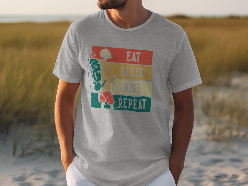 Gray t-shirt with graphic of skeleton hiker and text "Eat Sleep Hike Repeat".