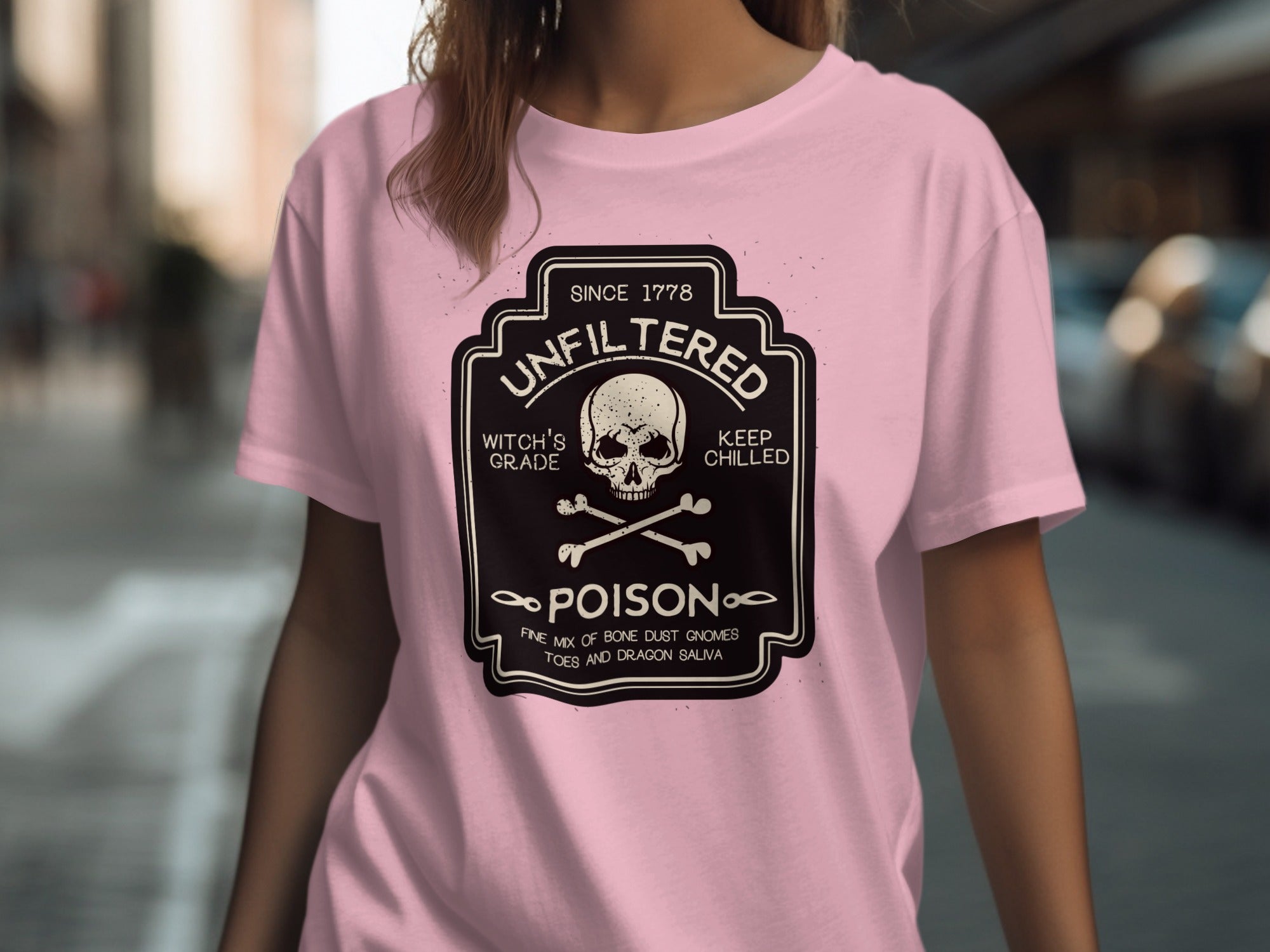 Pink t-shirt with a black and white "POISON" label featuring a skull and crossbones.