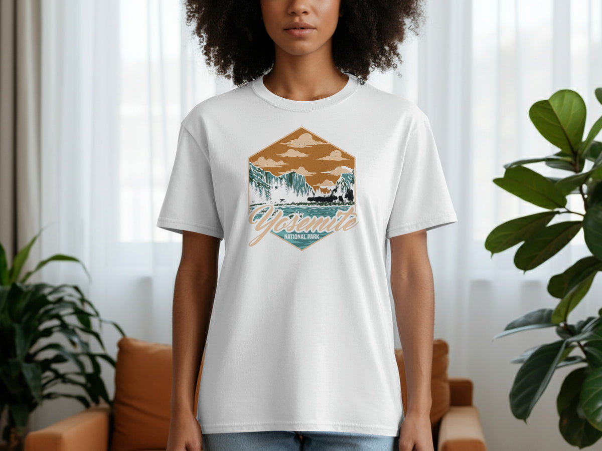 White t-shirt with a hexagonal graphic featuring a Yosemite National Park mountain and lake scene.