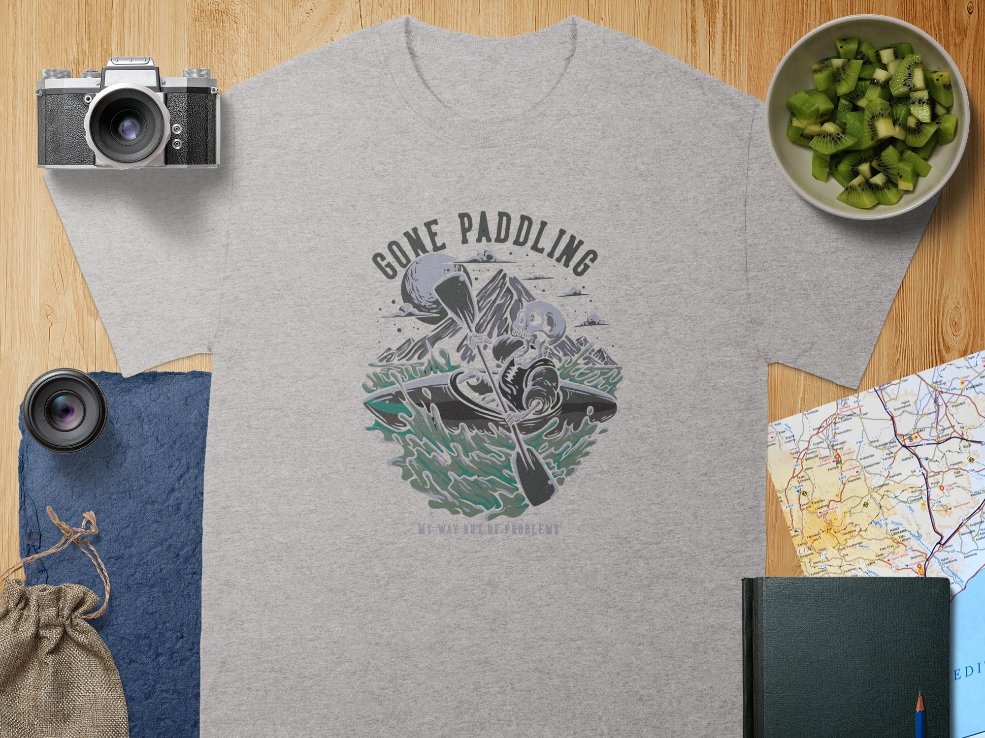 Grey t-shirt with "Gone Paddling, My Way Out of Problems" graphic.