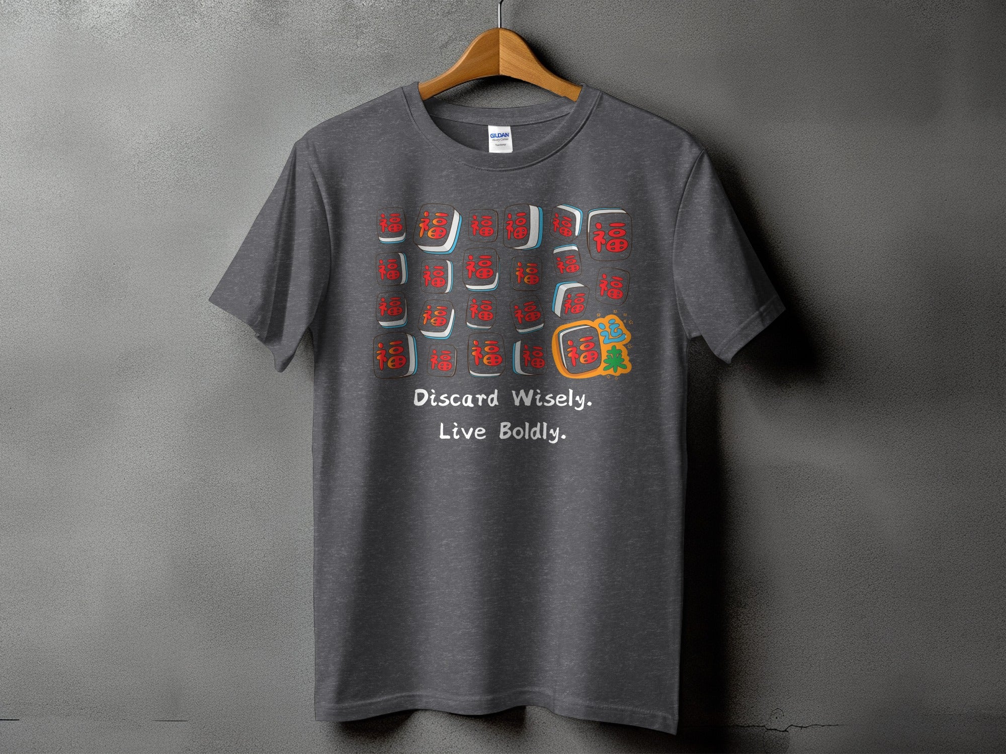 Dark gray t-shirt with mahjong tiles and "Discard Wisely. Live Boldly." text.