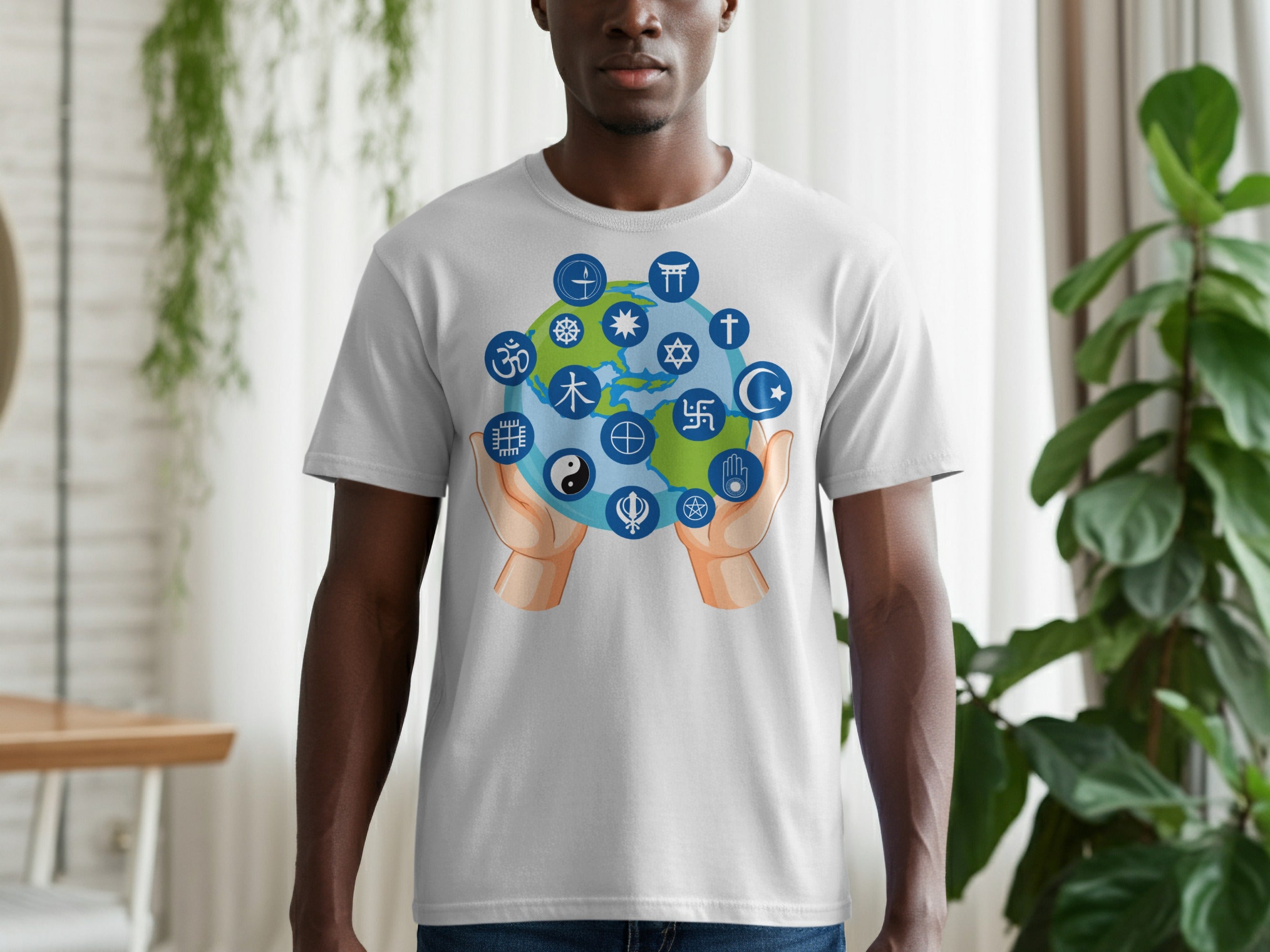 T-shirt graphic of hands holding a globe surrounded by religious and cultural symbols.