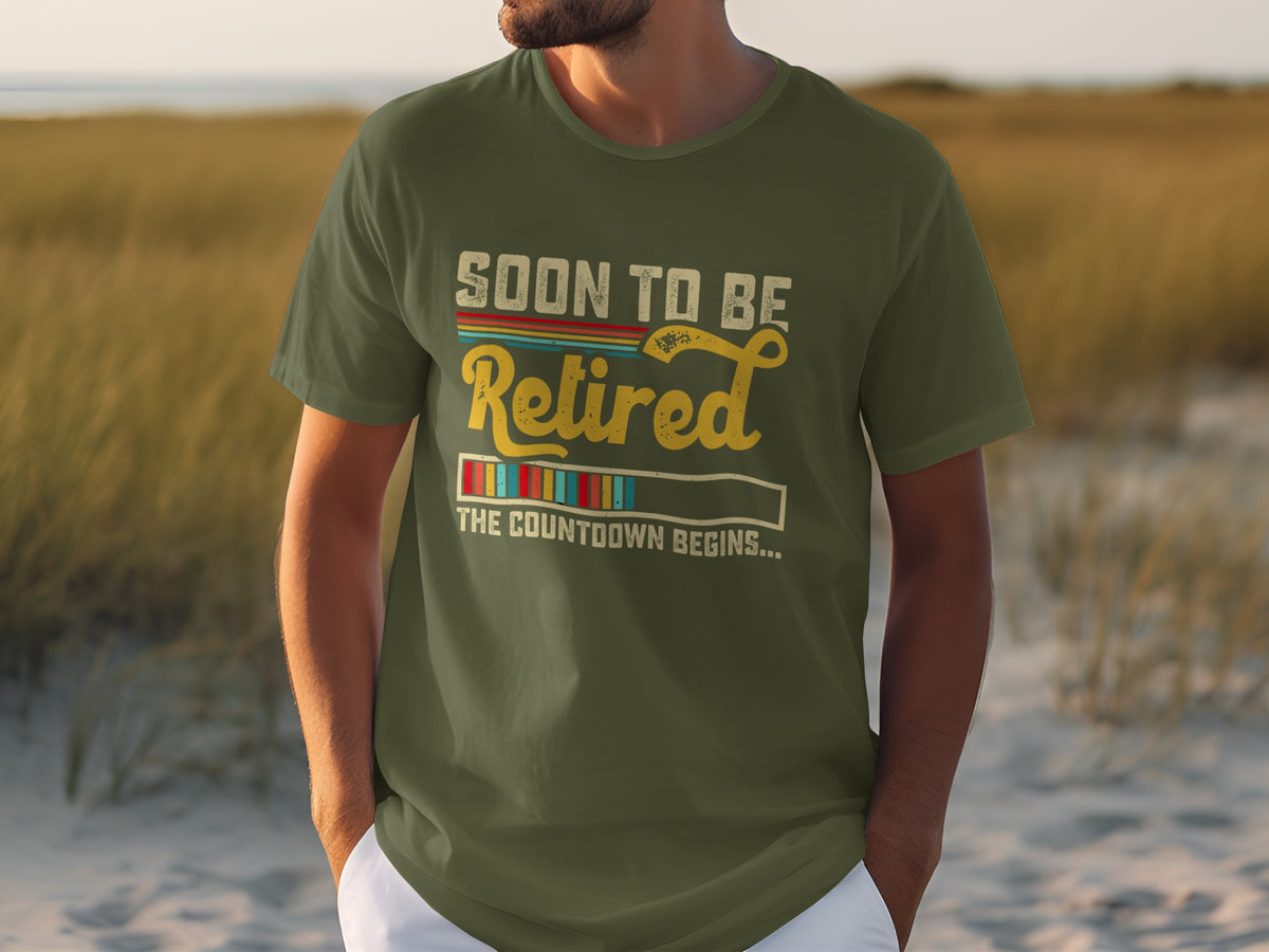Green t-shirt with "SOON TO BE Retired THE COUNTDOWN BEGINS..." text.