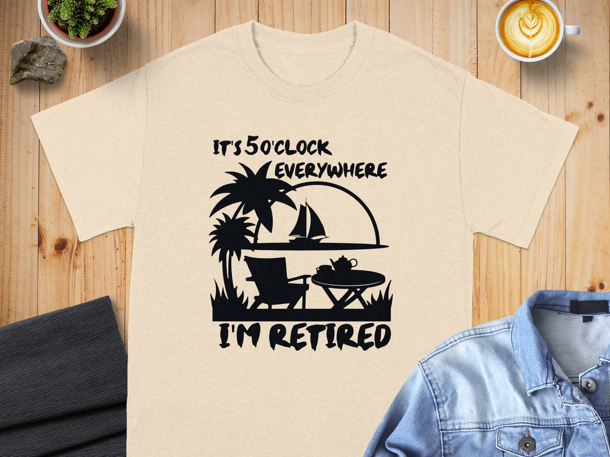 Light peach t-shirt with black graphic: "It's 5 O'clock Everywhere, I'm Retired".