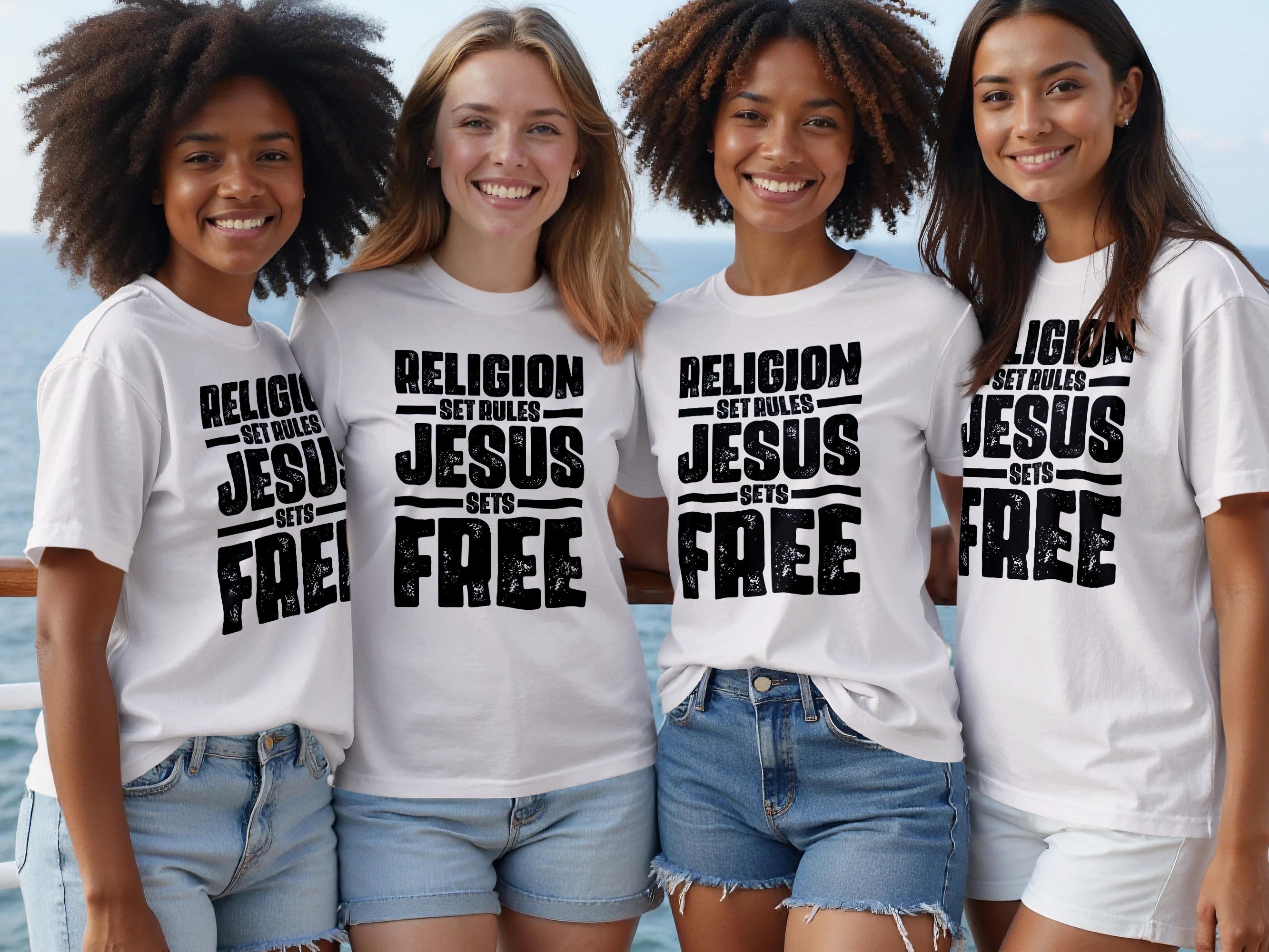 Four women wearing white t-shirts with "RELIGION SET RULES JESUS SETS FREE" text.