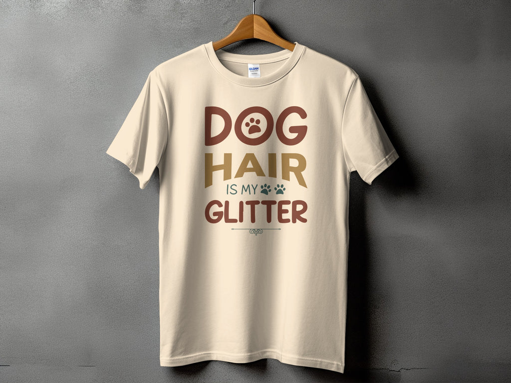 Cream t-shirt with "DOG HAIR IS MY GLITTER" text and paw prints.