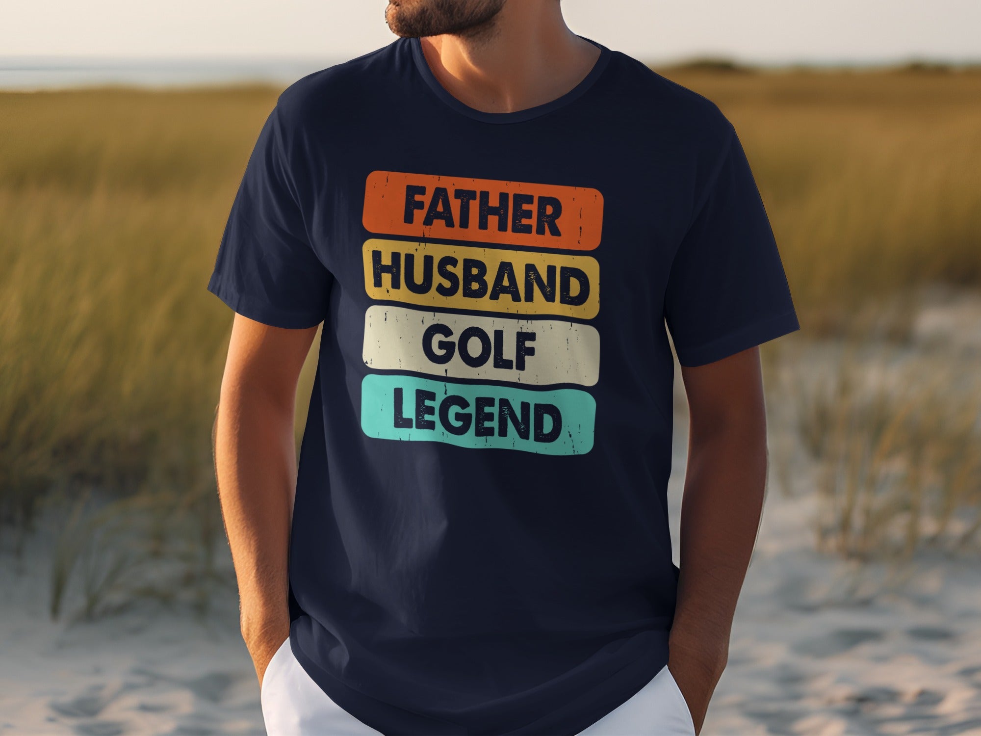 T-shirt with text "FATHER HUSBAND GOLF LEGEND" in colored blocks.