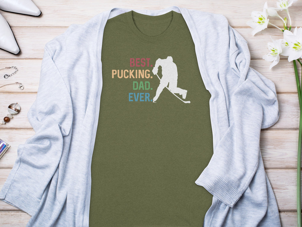 Green t-shirt with "BEST Pucking. DAD. EVER." text and hockey player silhouette.