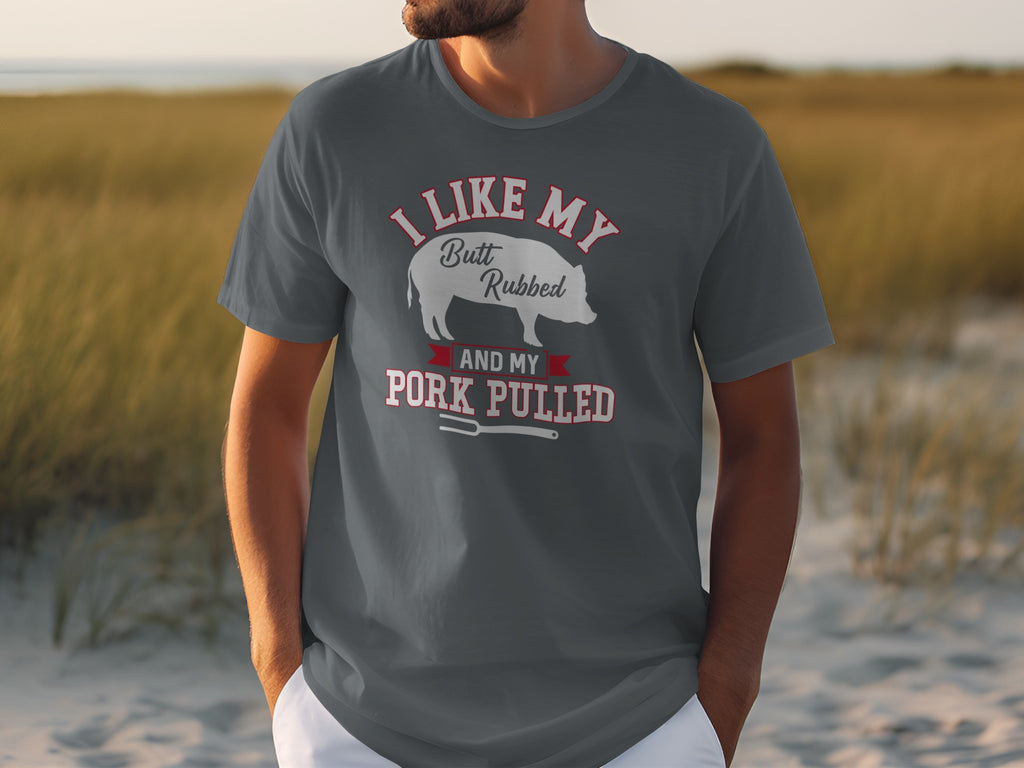 Grey t-shirt with text "I like my butt rubbed and my pork pulled" and a pig illustration.