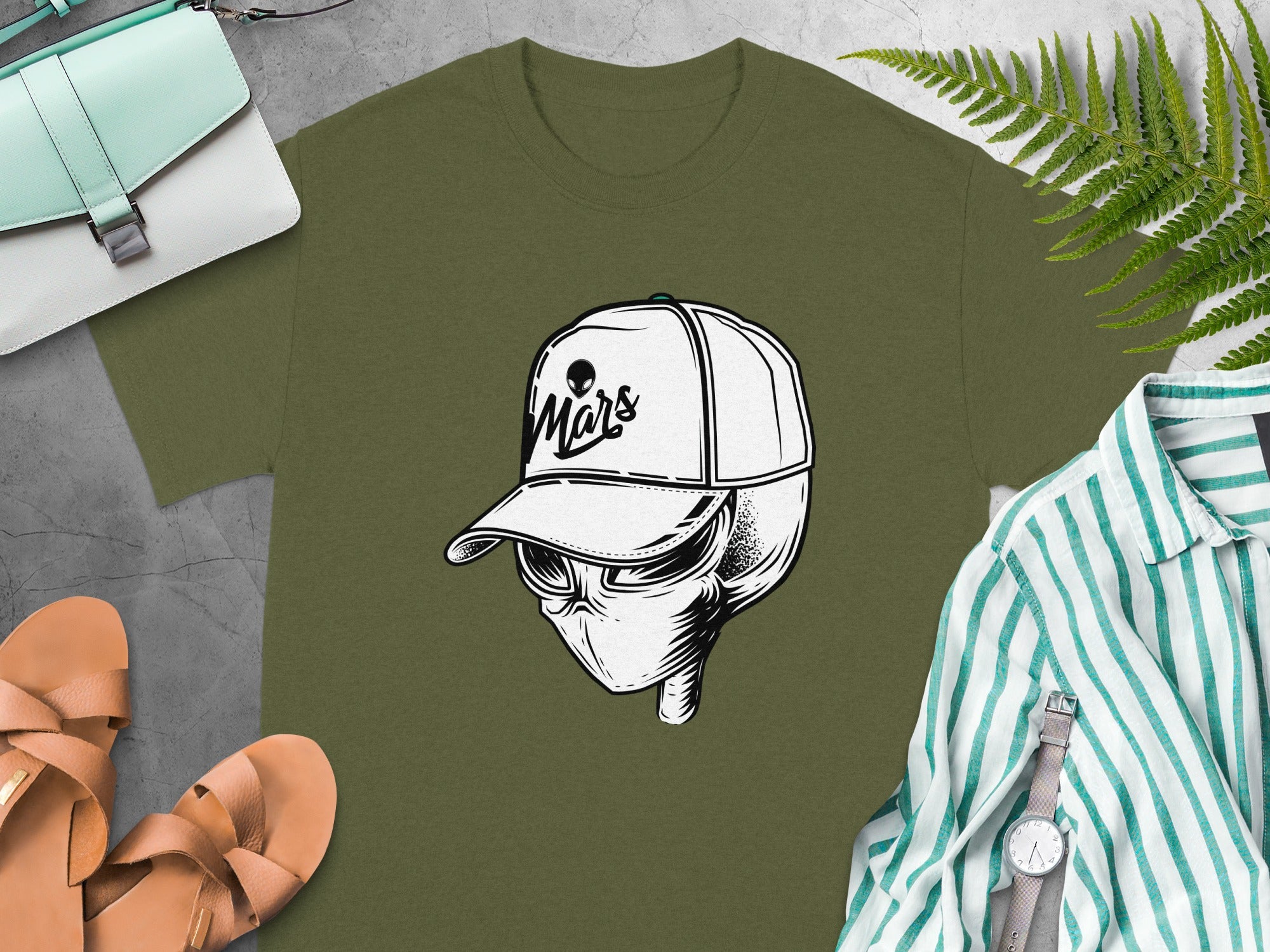 Olive green t-shirt with a stylized alien head wearing a baseball cap that says "Mars".
