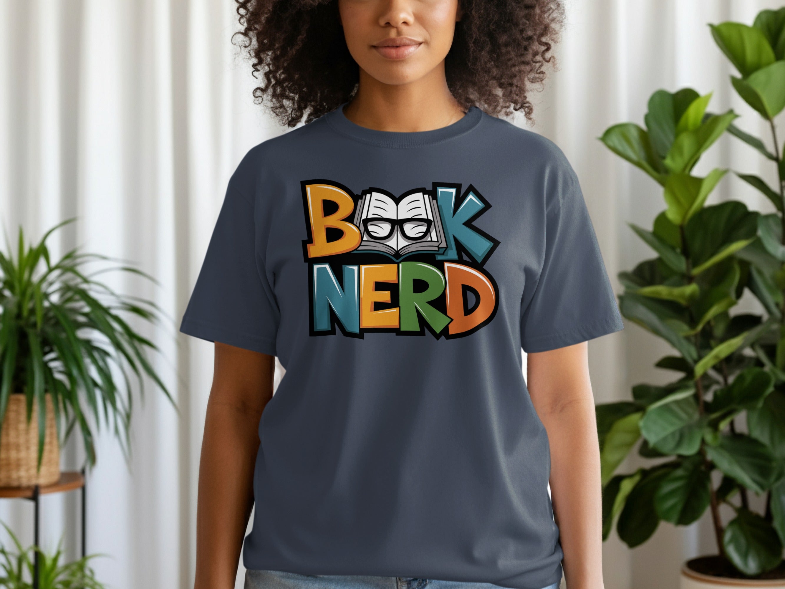 Dark gray t-shirt with multicolor "Book, Nerd" text and open book with glasses graphic.