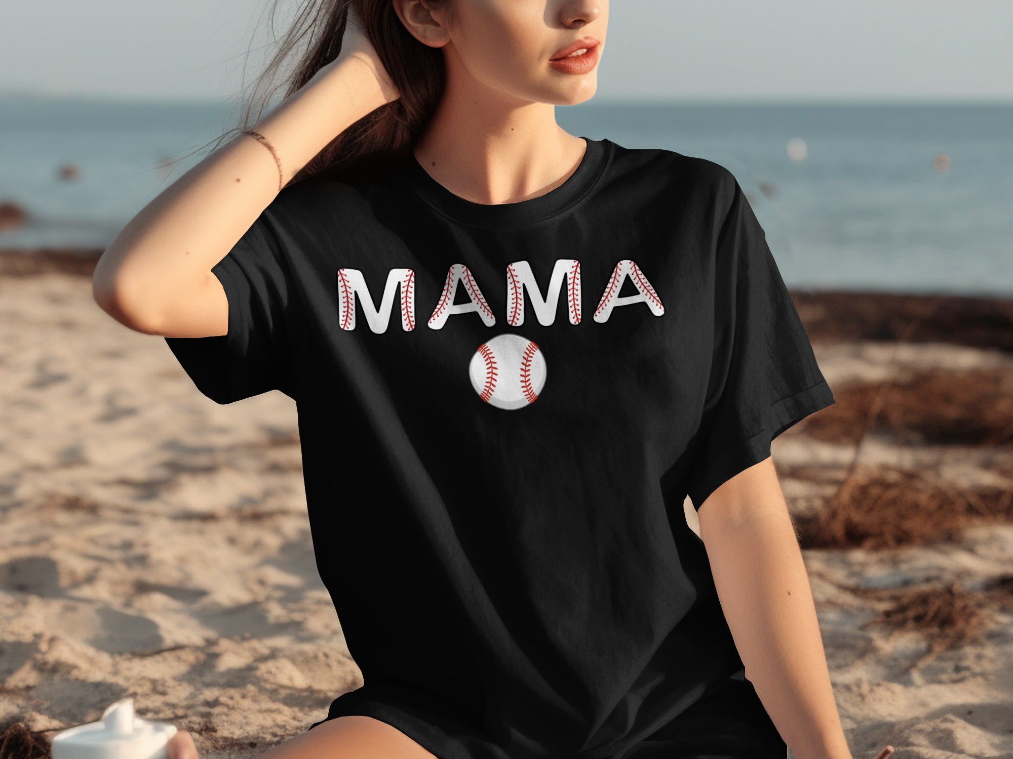 Black t-shirt with "MAMA" in baseball stitching and a baseball graphic.