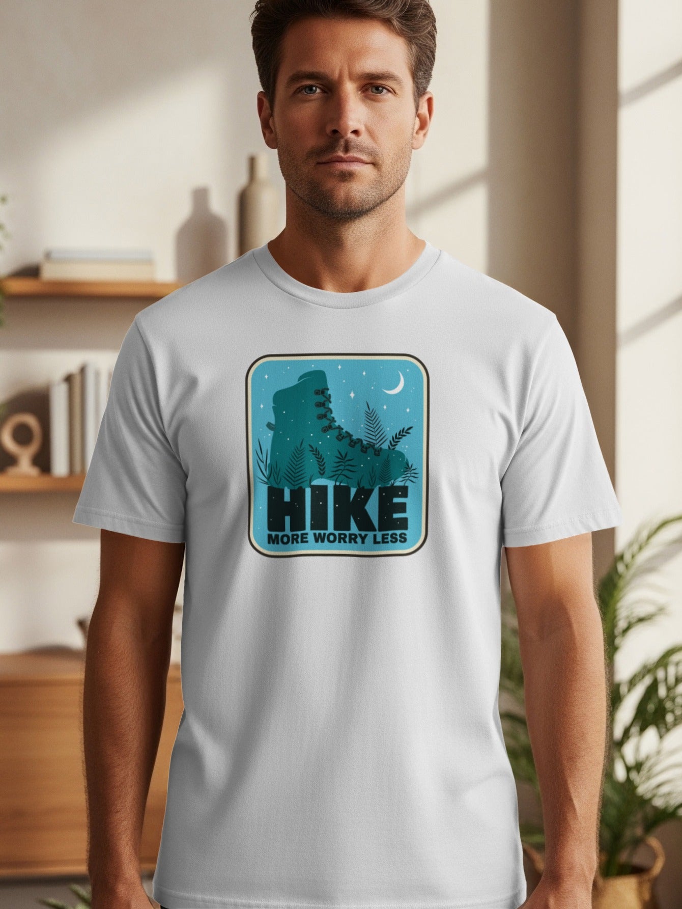 White t-shirt with "HIKE MORE WORRY LESS" text and a hiking boot graphic.