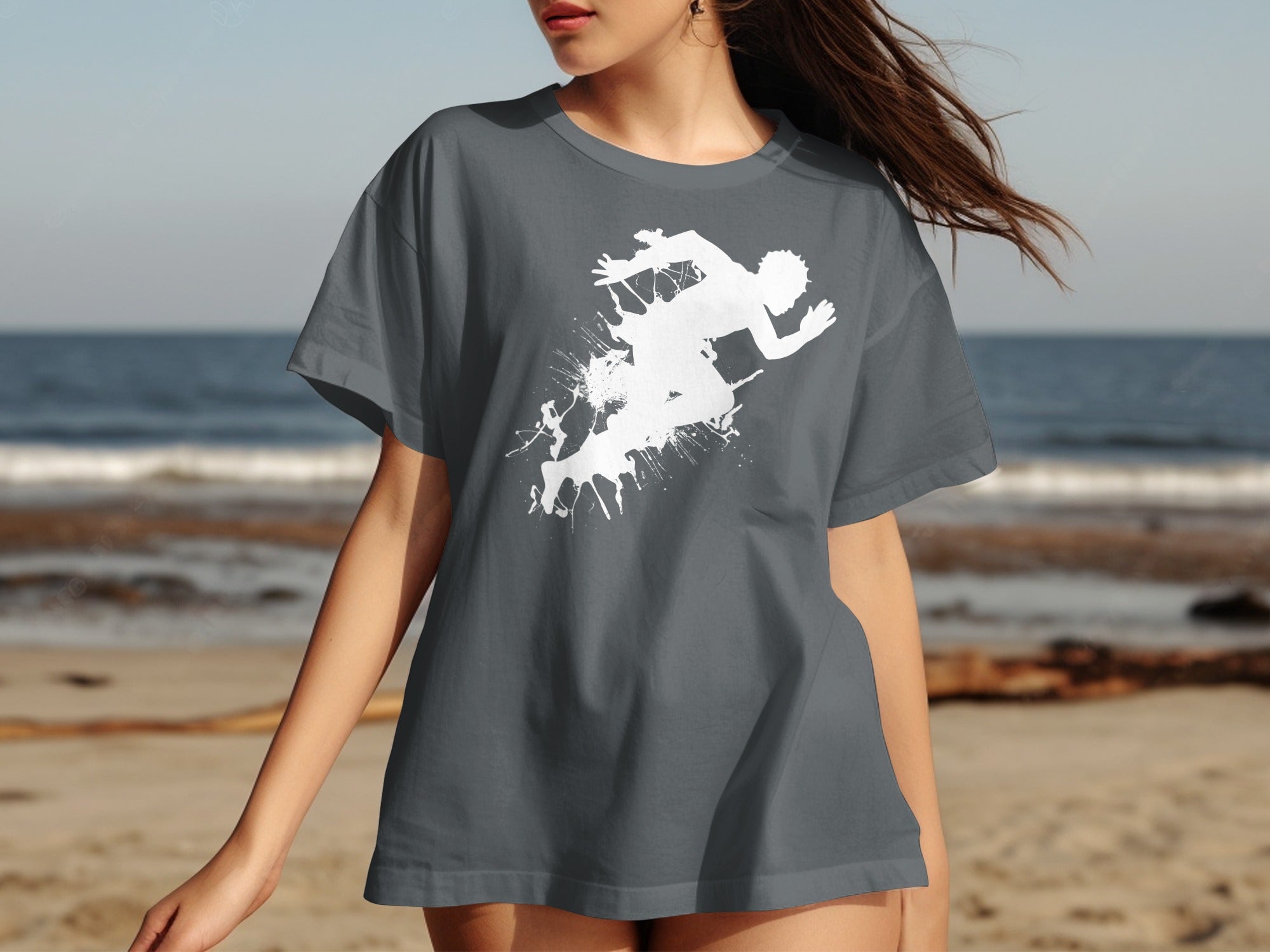Grey t-shirt with white running man graphic on a beach background.