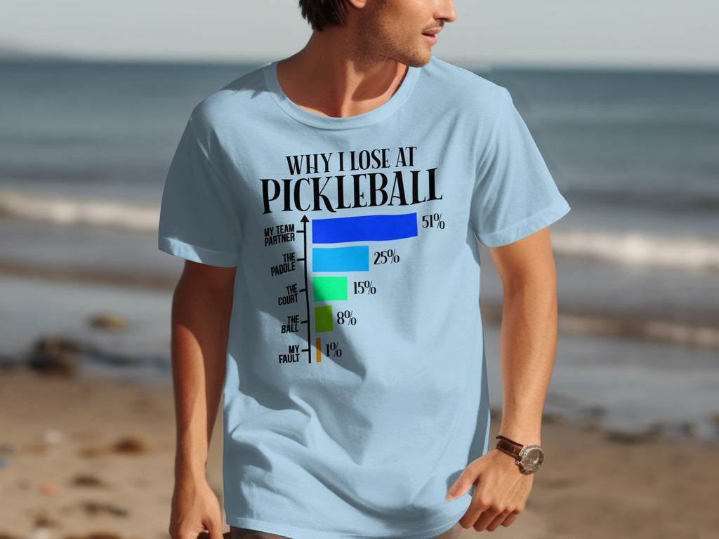 Light blue t-shirt with "Why I Lose at Pickleball" graphic and bar chart.