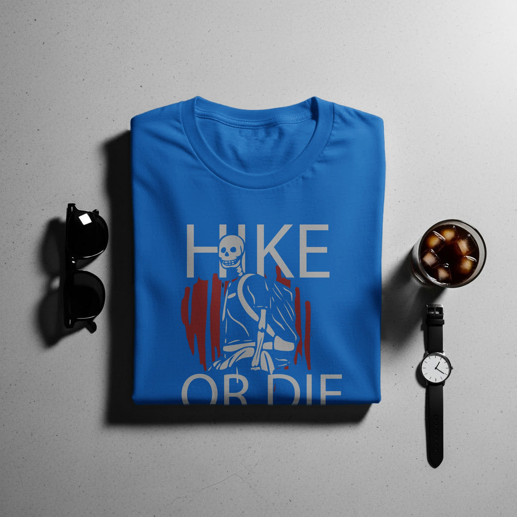 Blue t-shirt with "HIKE OR DIE" graphic featuring a skeleton and hiking gear.
